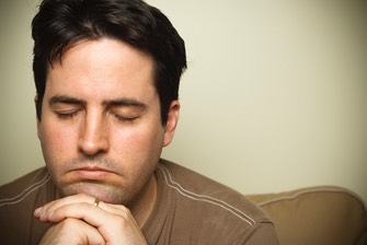 man praying on retreat